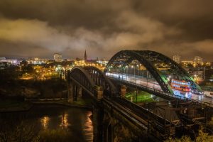 Image of Wearmouth Bridge and railway bridge at night 