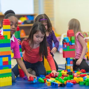 Young children playing with building blocks